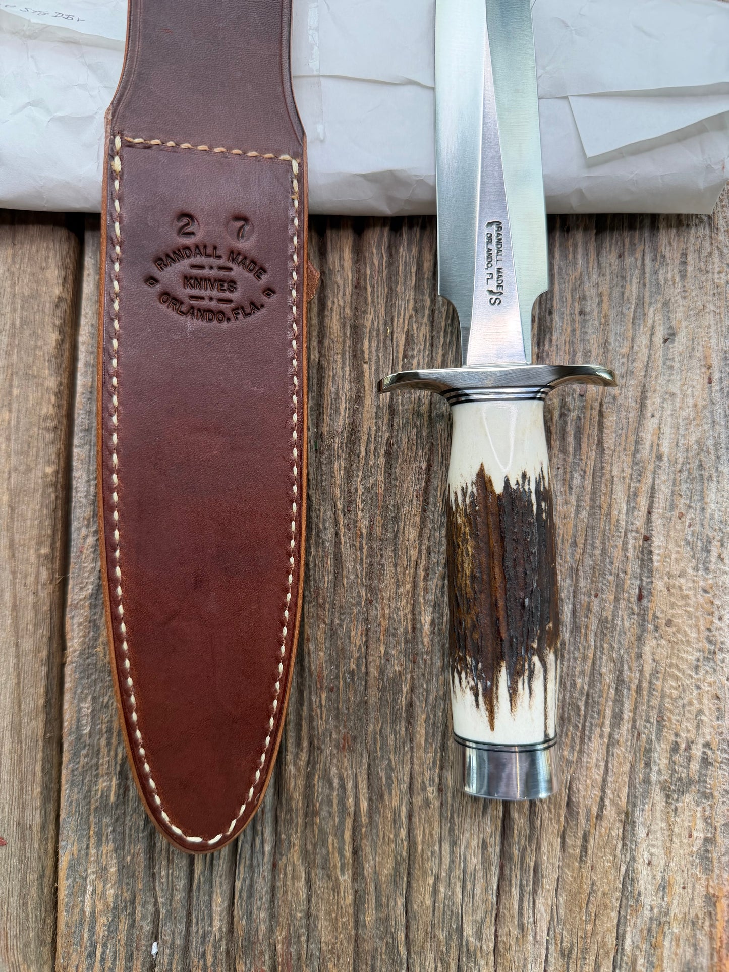 New in Paper Randall Made Knife Model 2-7 with a Stag handle, Stainless steel blade, Nickel silver Hilt, black and aluminum spacers, loaded!!