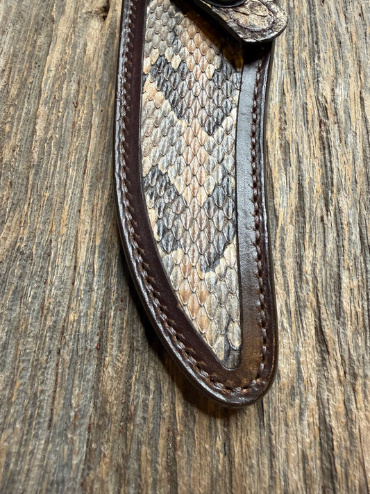 Randall Model 27 sheath with a Canebrake RattleSnake skin from Treeman Sheaths. Vibrant colors and along side Copperheads the hardest skin to source.