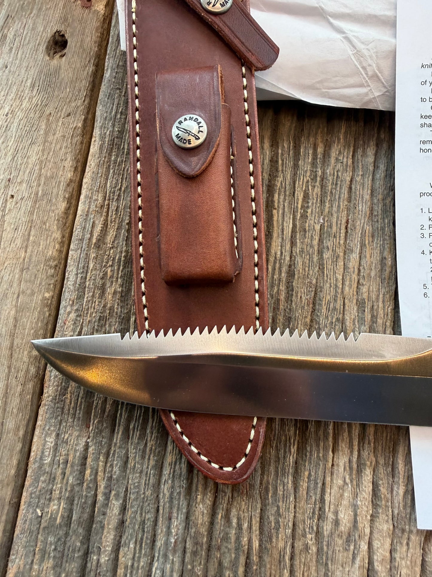 New in Paper Randall Made Knife Model 1-8 in Thuya wood. Stainless, single Black spacer, Sawteeth, Nickel Hilt.