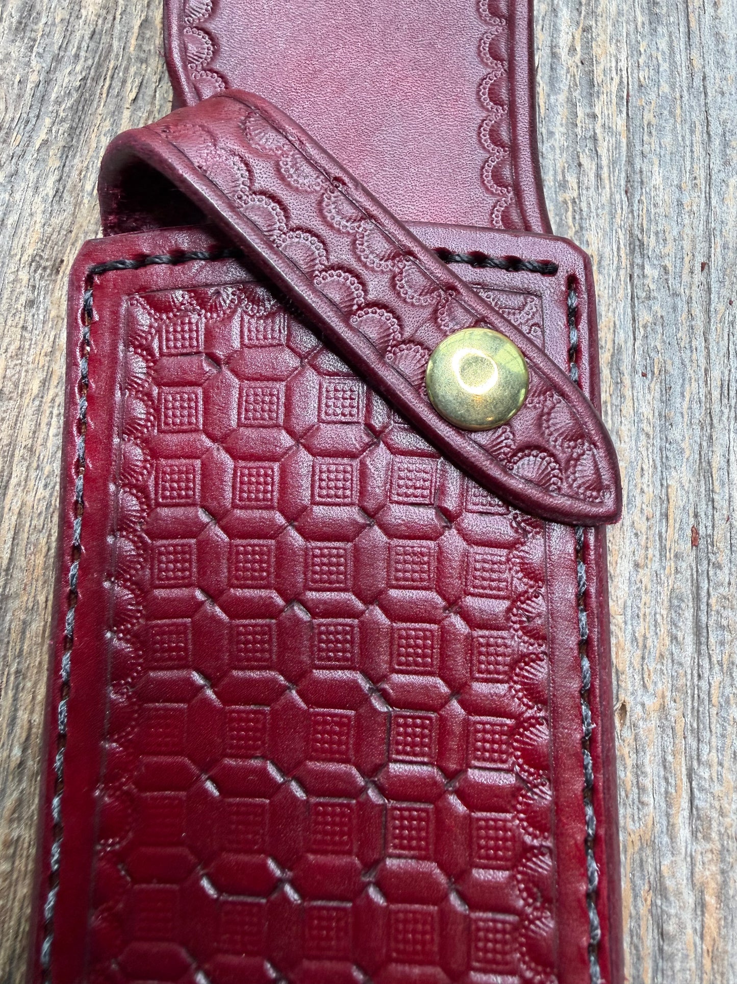 Randall Model 12-8 “Big Bear” sheath in Ox Blood Red stamped leather from Sullivans by Gutcher. Parquet window pattern, mesmerizing !!