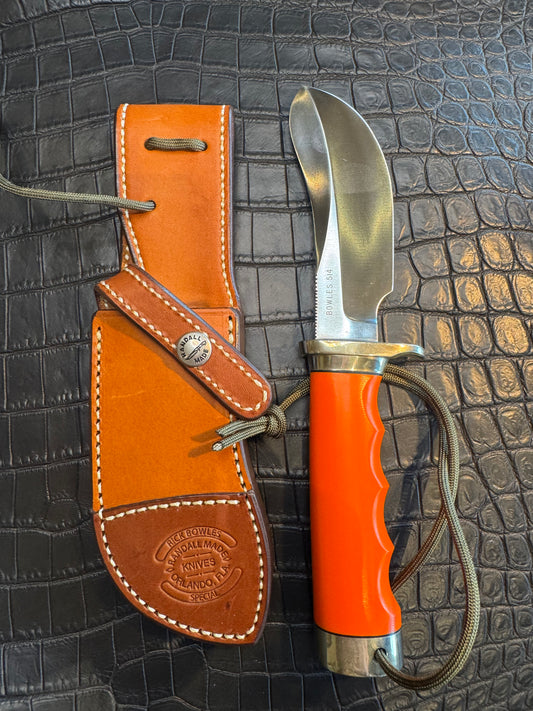 Randall Model Bowles Skinner Dealer Special Knife # 514 in Orange G10. This knife is a one of one. Two tone Leather Custom sheath Made at Sullivan’s by Gutcher.