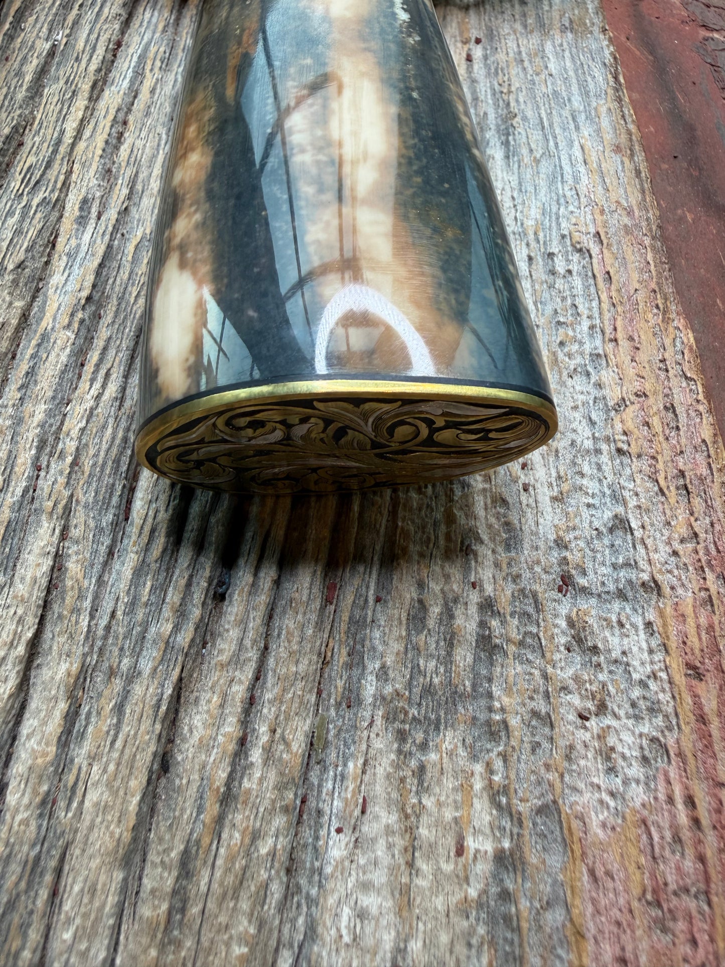 Randall Model 12-11 Smithsonian “Smitty” in a Huge piece of Green, Brown and Blue Fossil Walrus Ivory. Brass Hilt and Brass Butt plate fully engraved in Silver from Jere Davidson.  Stunning piece.