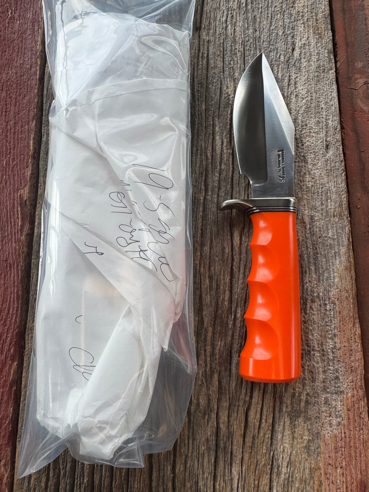 New in paper Randall Model 19-5 with a nice piece of customer supplied Orange G10 with finger grooves. Stainless Steel, Nickel Silver Hilt and a raw natural end.