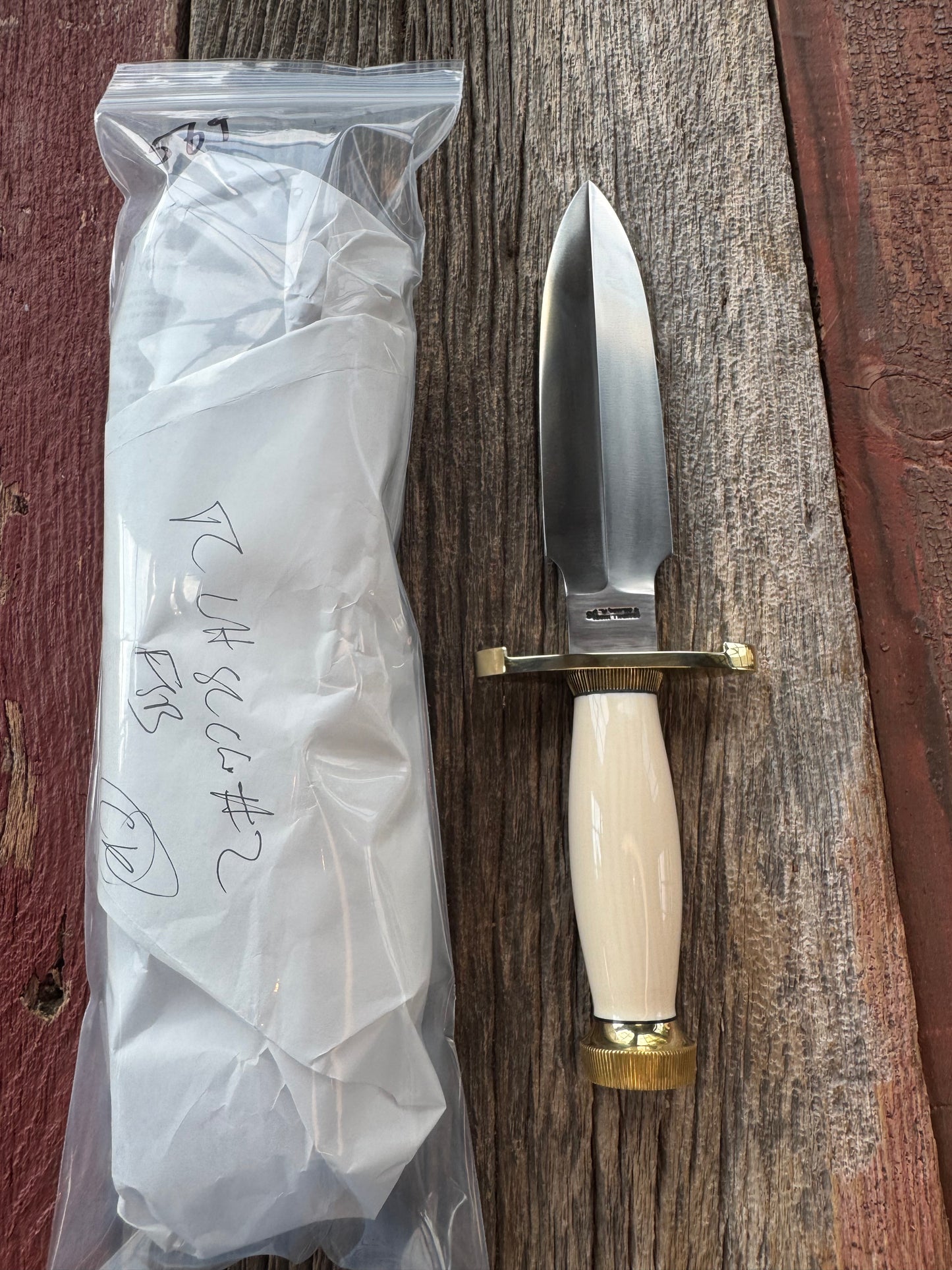 New in paper Randall Clinton Special with a nice piece of customer supplied Warthers Resin with a Stainless Steel blade, lugged Brass Hilt, brass scalloped butt cap and collar.