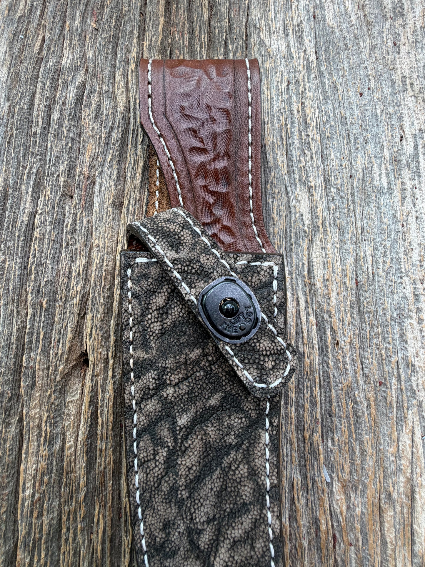 New Randall Model 27 Sheath in Exotic thick and textured Black and Grey Elephant Ear  on brown leather from Treeman with a black Canteen snap. Hand tooled belt loop. Killer sheath.