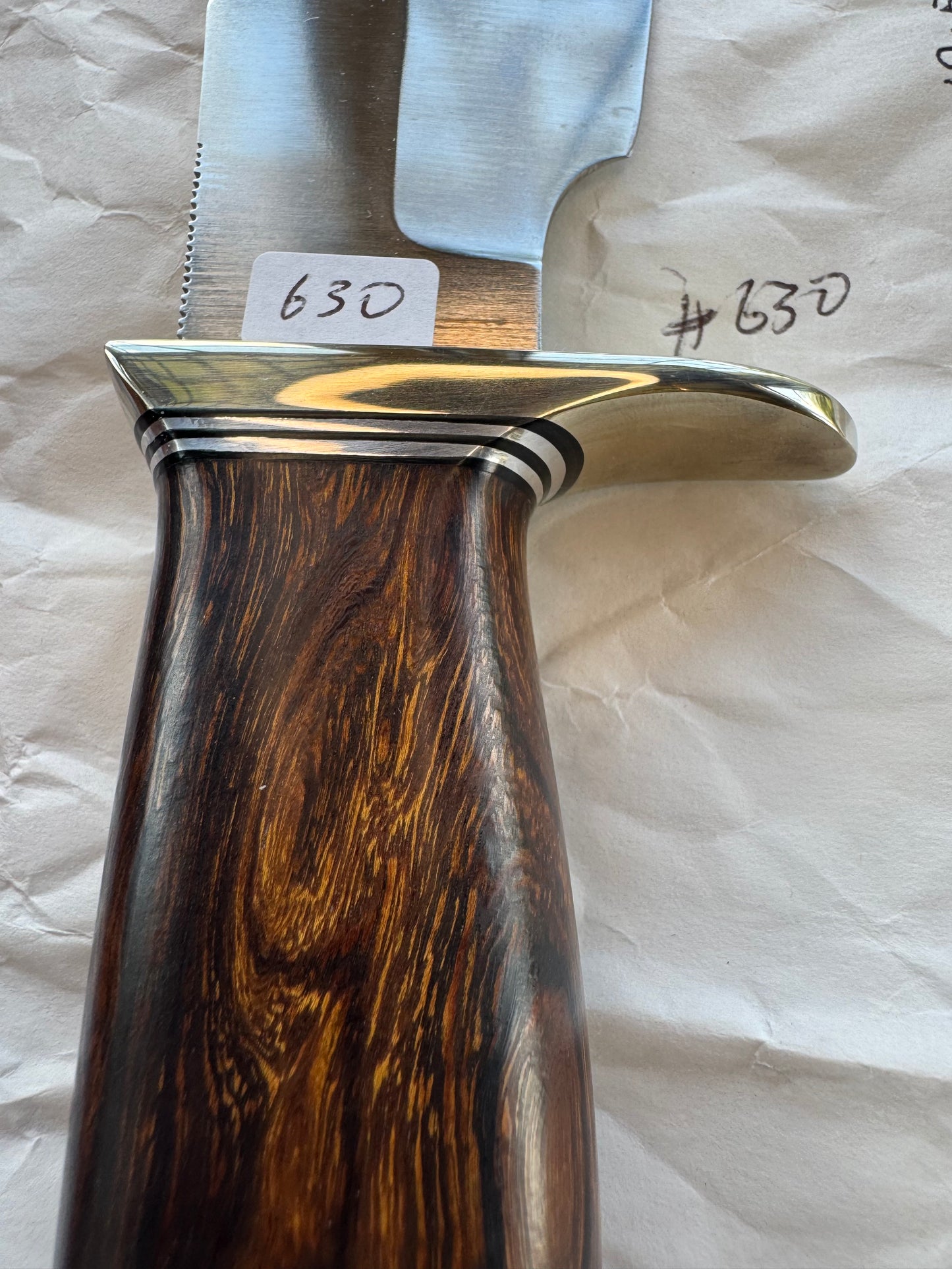 New in Paper Randall Model 19-5 Bushmaster with an Ironwood handle. SS blade, Nickel silver single hilt. Brown leather sheath.