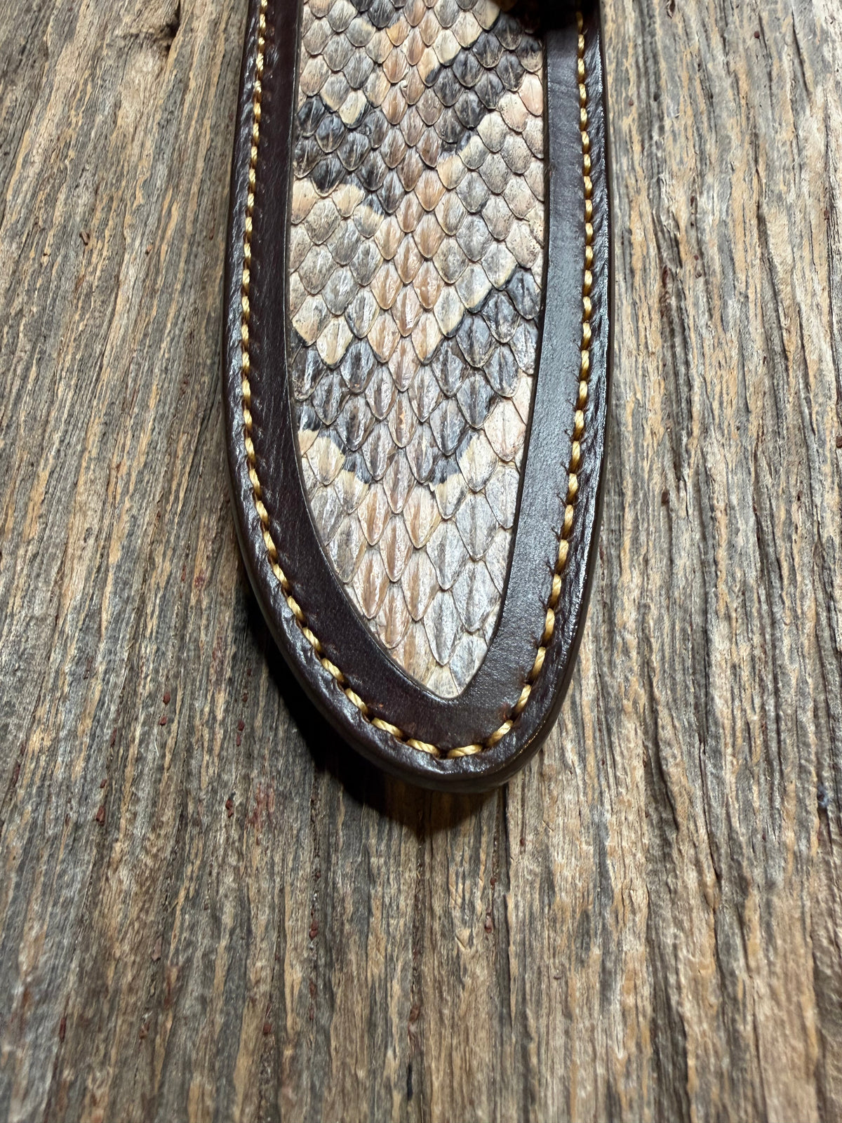 Randall Model 25-6 sheath with a Canebrake RattleSnake skin from Treeman Sheaths. Vibrant colors and along side Copperheads the hardest skin to source.