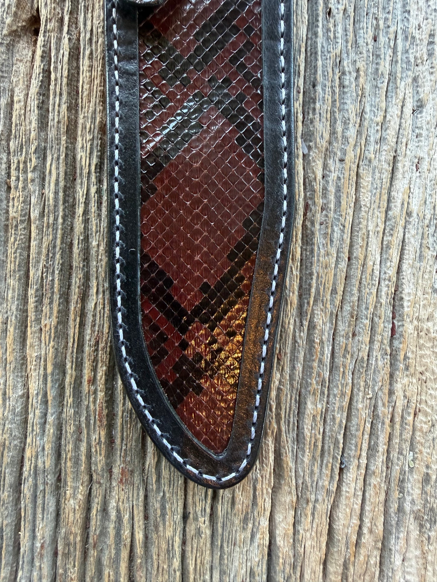 New Randall Model 1-7 Sheath in Exotic Brown Python Snake skin on black leather from Treeman with a black Canteen snap. Hand tooled belt loop. Deviated white stitching. Killer sheath.