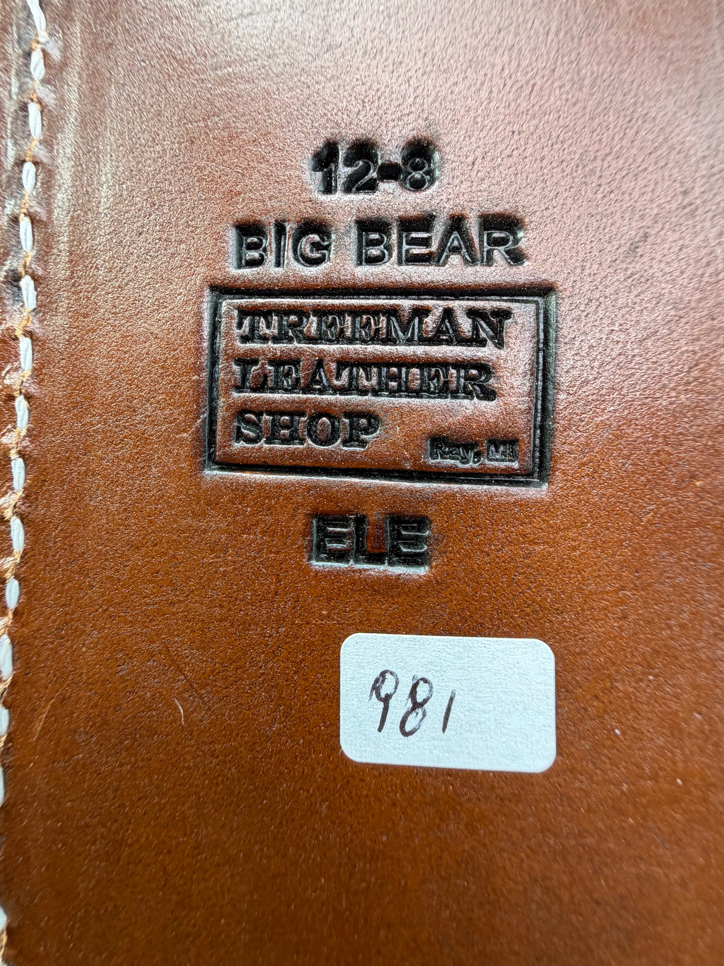New Randall Model 27 Sheath in Exotic thick and textured Black and Grey Elephant Ear  on brown leather from Treeman with a black Canteen snap. Hand tooled belt loop. Killer sheath.