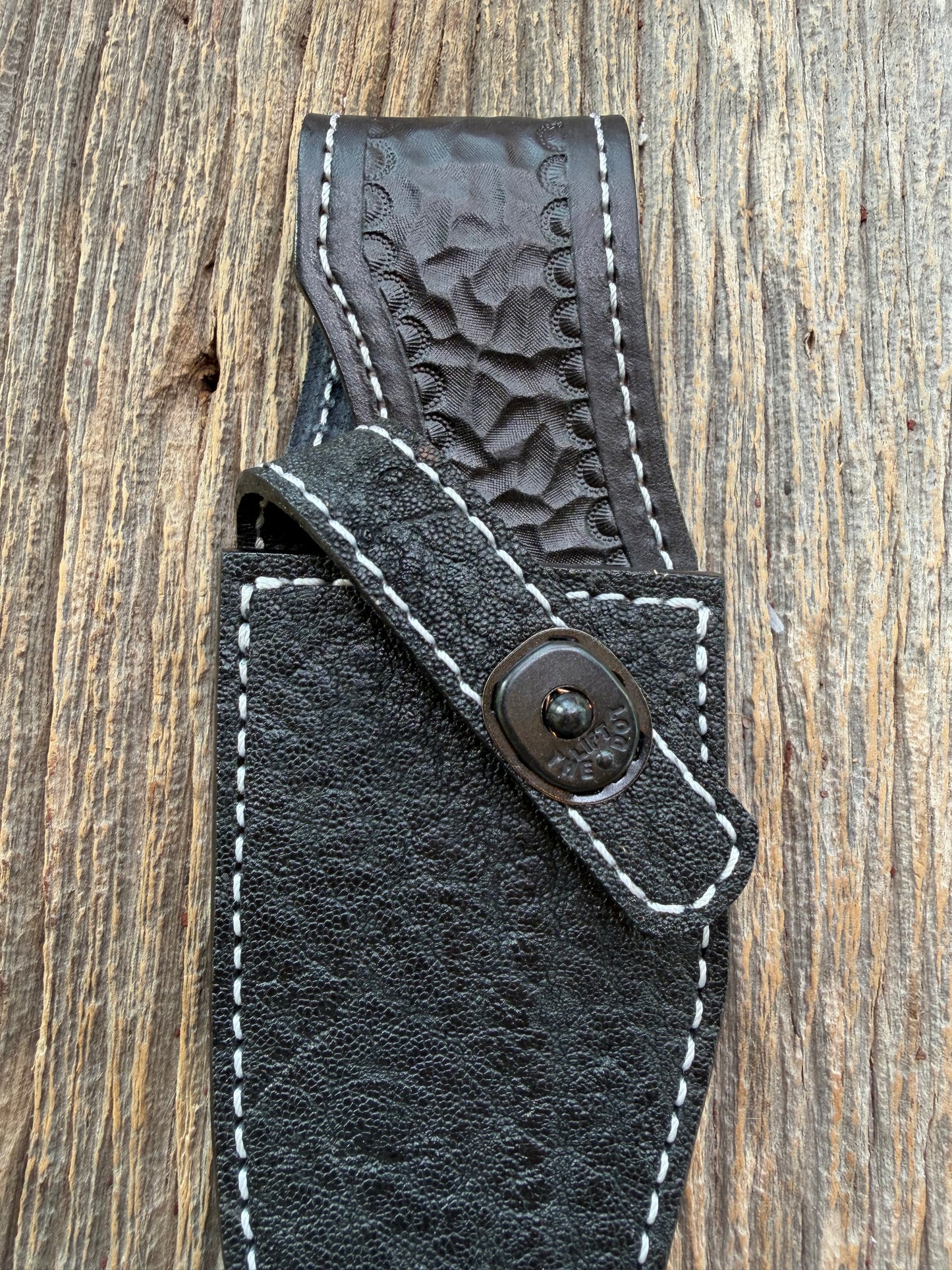 New Randall Model 19-5 Sheath in Exotic thick and textured Black Elephant hide on black leather from Treeman with a black Canteen snap. Hand tooled belt loop. Killer sheath.