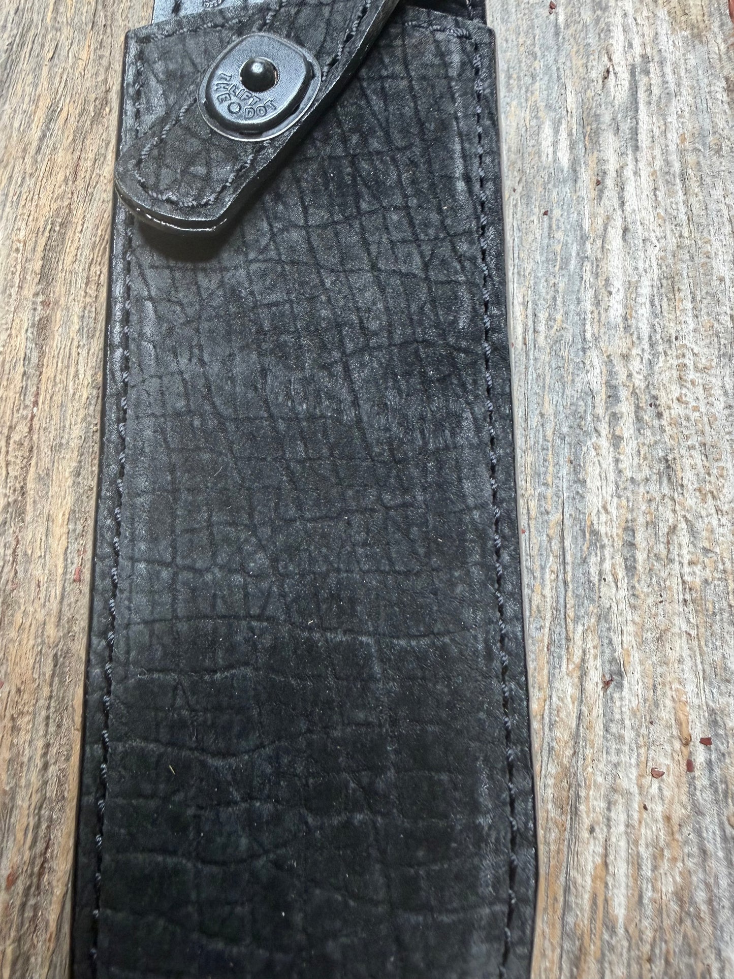 Randall Model 12-9 in Black Hippo, forward curved hilt, black Canteen Snap, full brass stamping and stitching.