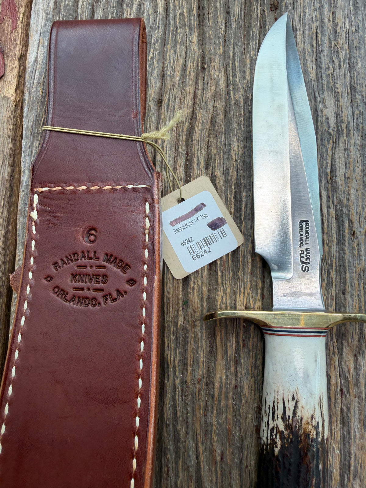 New Randall Model 1-6 with a Stag handle. Stainless steel blade, brass hilt and natural butt. Red white and Blue spacers.
