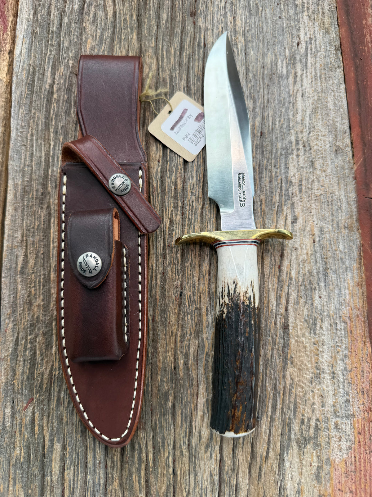 New Randall Model 1-6 with a Stag handle. Stainless steel blade, brass hilt and natural butt. Red white and Blue spacers.