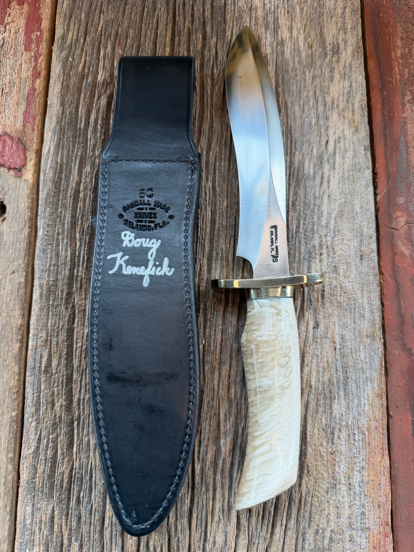 Randall Model 12-8 Small Sasquatch with a nice piece of Musk Ox. Nickel Silver collar and raw natural end.