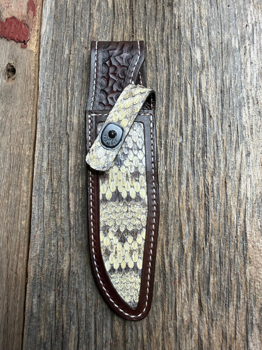 Randall Model 1-6 sheath with an Eastern Diamondback RattleSnake skin from Treeman Sheaths. Hand tooled belt loop, canteen snap. One the hardest skins to source.