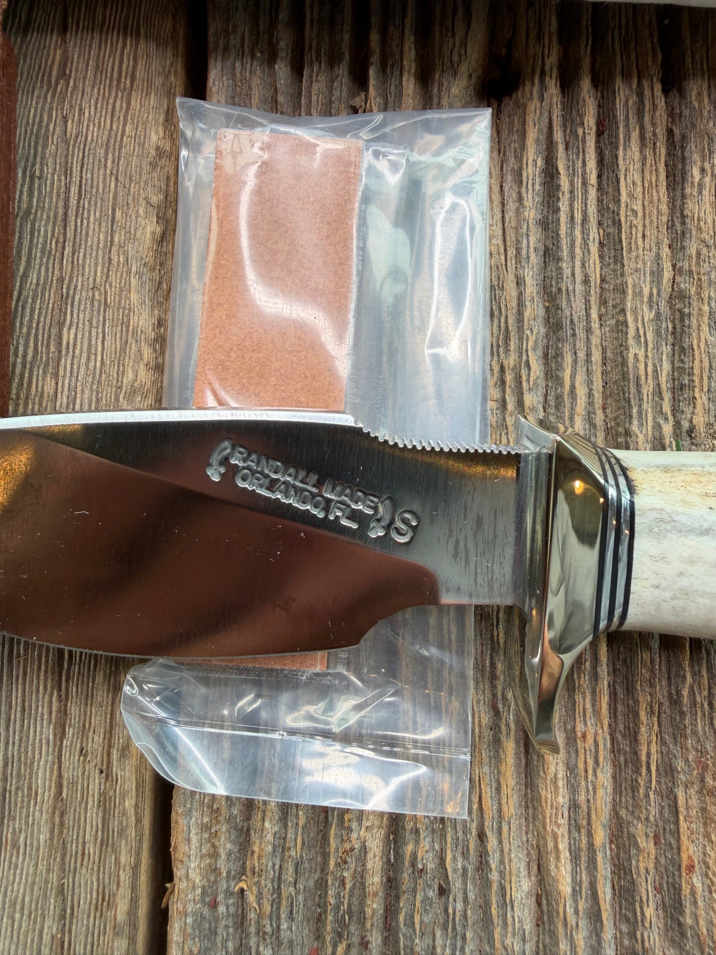 New in Paper Randall Made Knife Model 11-4 with a Stag handle, Stainless, Nickel silver single Hilt, Black and aluminum spacers.