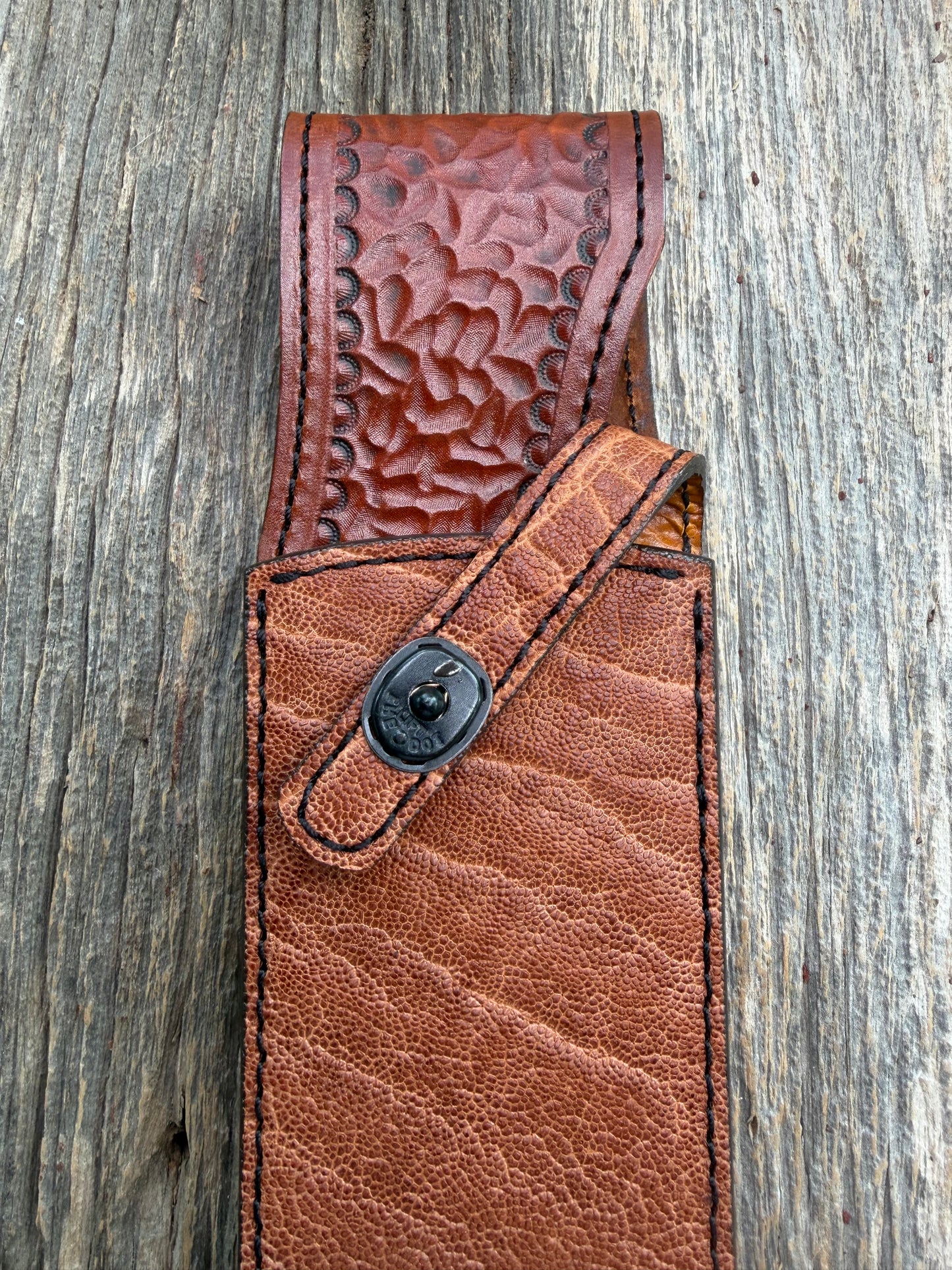 New Randall Model 12-11 Smithsonian Sheath in Exotic thick and textured Rust colored Elephant hide on brown leather from Treeman with a black Canteen snap. Hand tooled belt loop. Killer sheath.