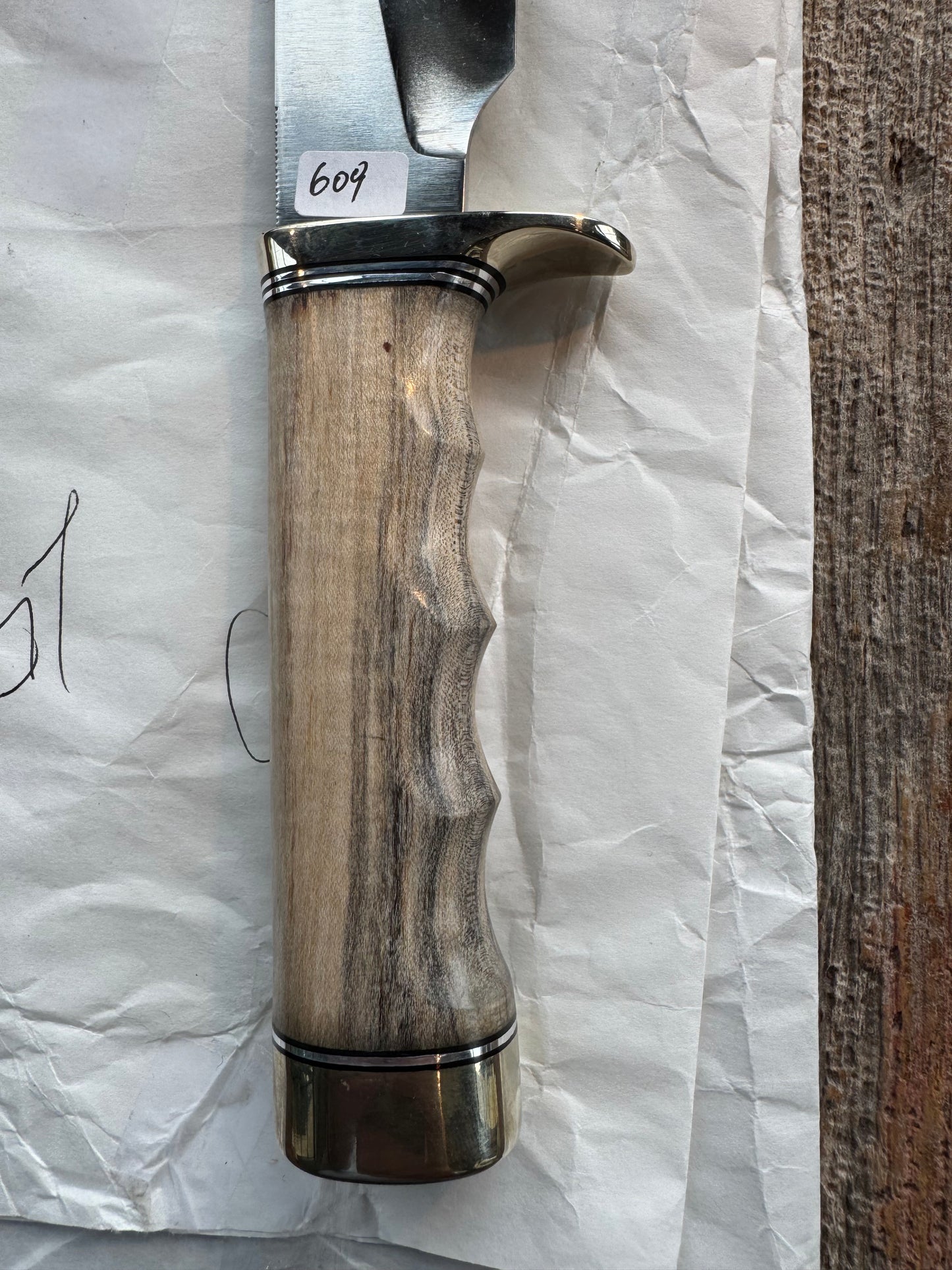 New in Paper Randall Non Catalog Model Sergeants Special, Maple handle with finger grooves. Carbon blade, Nickel silver single hilt and butt cap. Brown leather sheath.