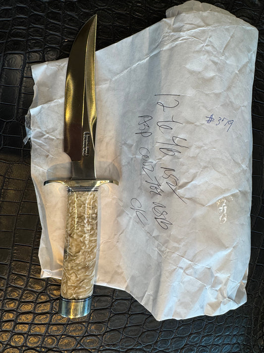 In Paper Randall Model 12-6 in Musk Ox. Lead Bullet Fragment embedded in the Musk ox. Nickel Silver Hilt and butt cap.