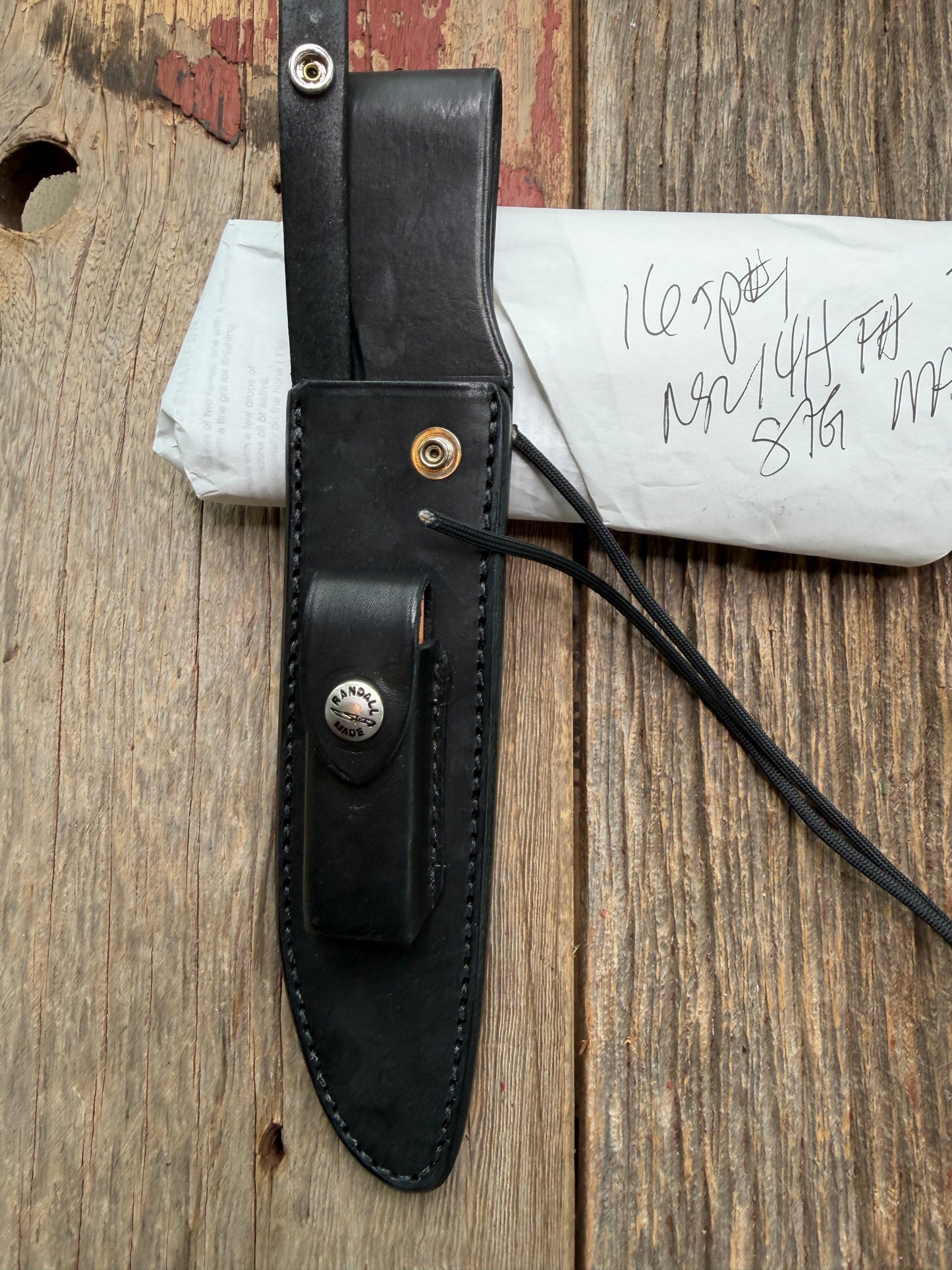 New in Paper Randall Model 16 SP#1 Special fighter with a Black Micarta handle. SS blade, Nickel silver Double hilt. Lanyard. Brown leather sheath.