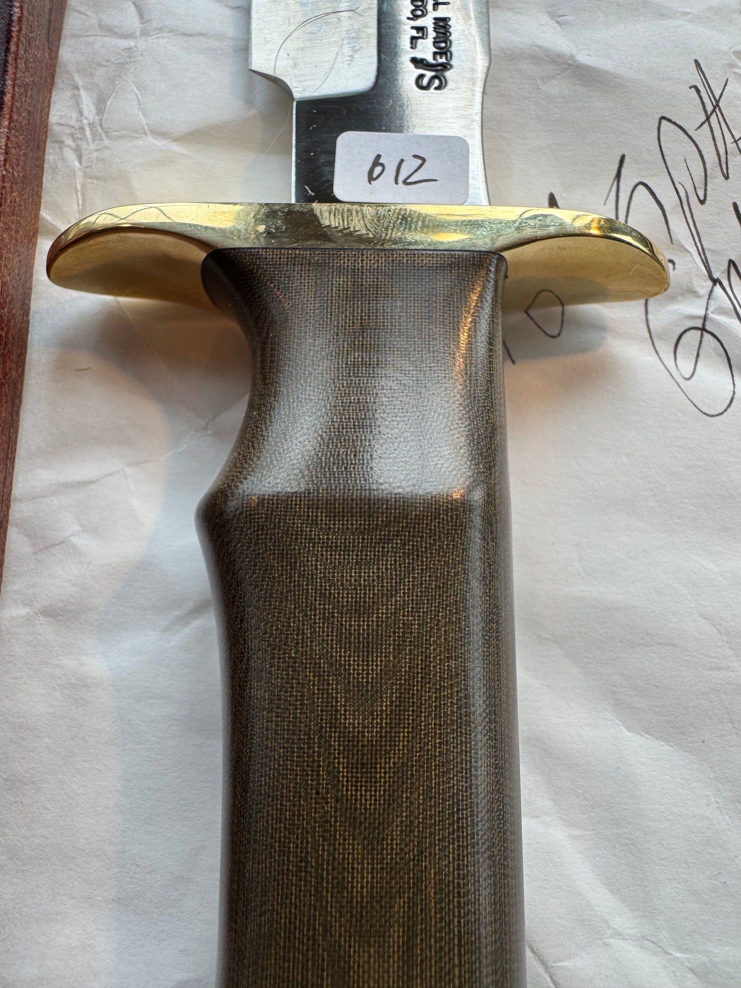 New in Paper Randall Model 16 SP#1 Special fighter with a Green Micarta handle. SS blade, Brass hilt. Lanyard. Brown leather sheath.