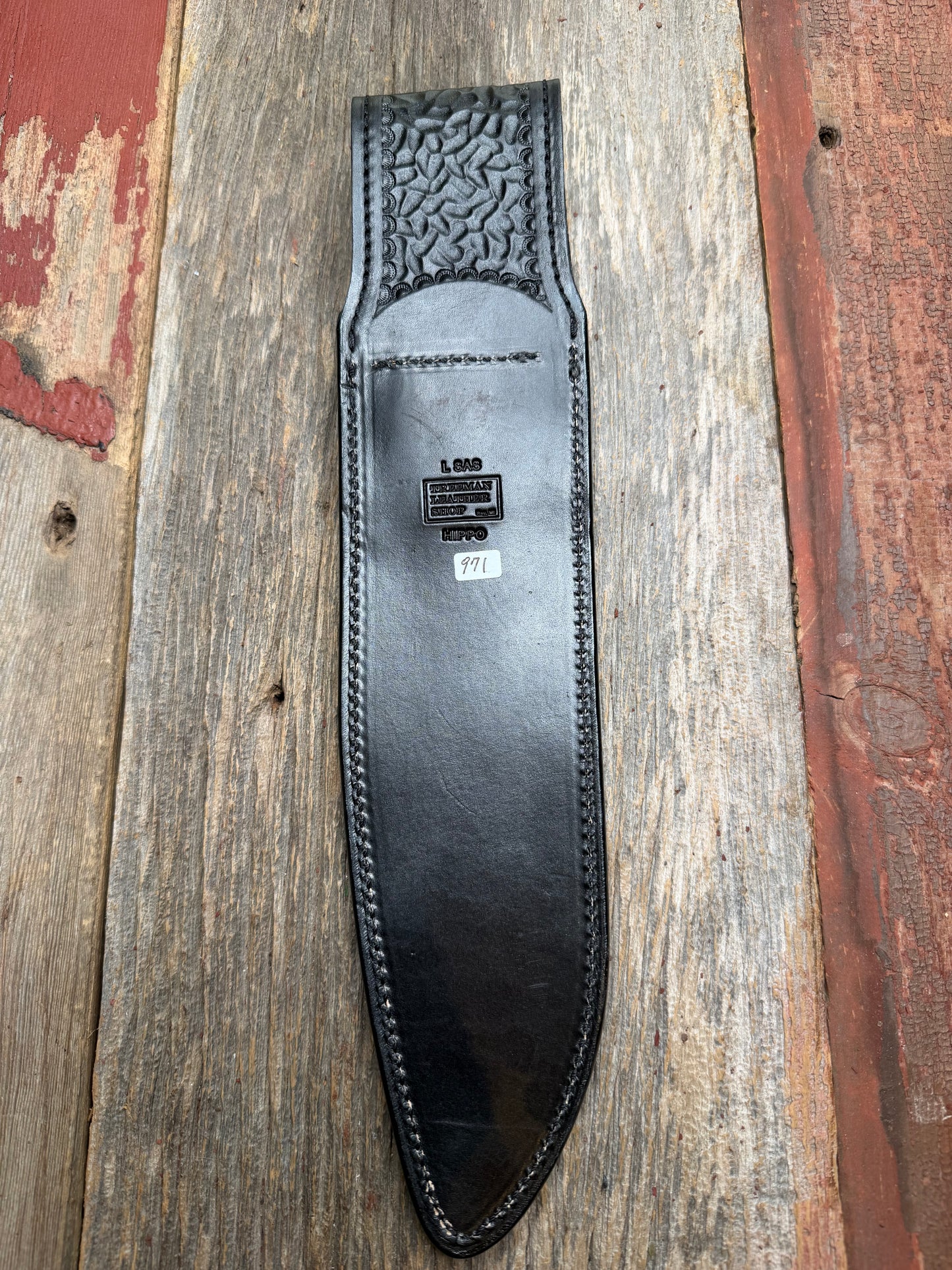 Randall Model 12-11 Large Sasquatch in Black Hippo, forward curved hilt, black Canteen Snap, full brass stamping and stitching.