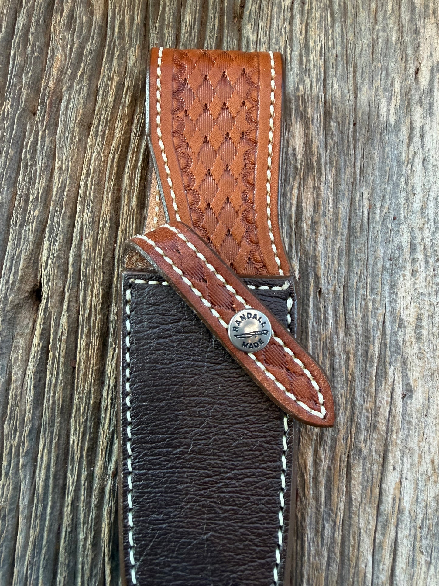 New Randall Model 25-5 Sheath in Exotic Brown Cape Buffalo with full leather hand tooled belt loop. Randall snap and stamp on the back. Custom Made at Sullivan’s by Gutcher