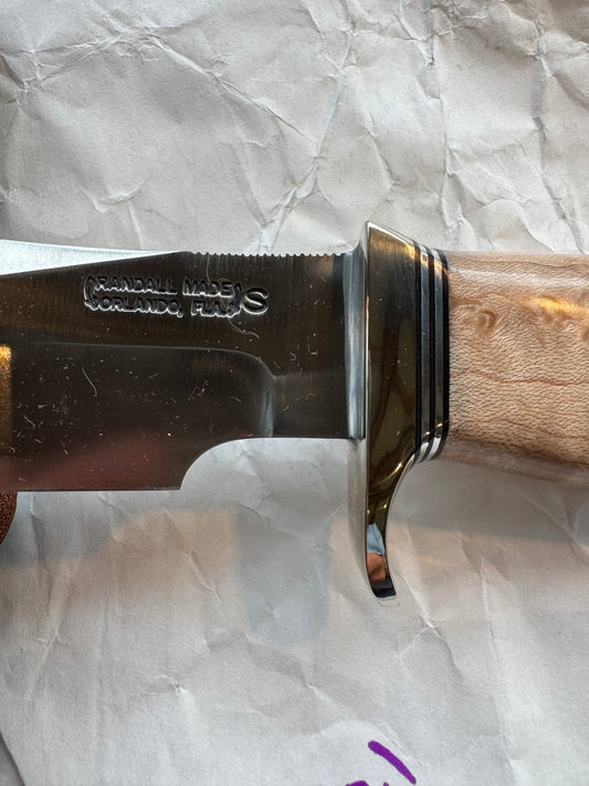 New in Paper Randall Model 23 Game Master Stainless steel blade, Nickel silver hilt and aluminum butt cap. Brown leather sheath. Maple wood handle.