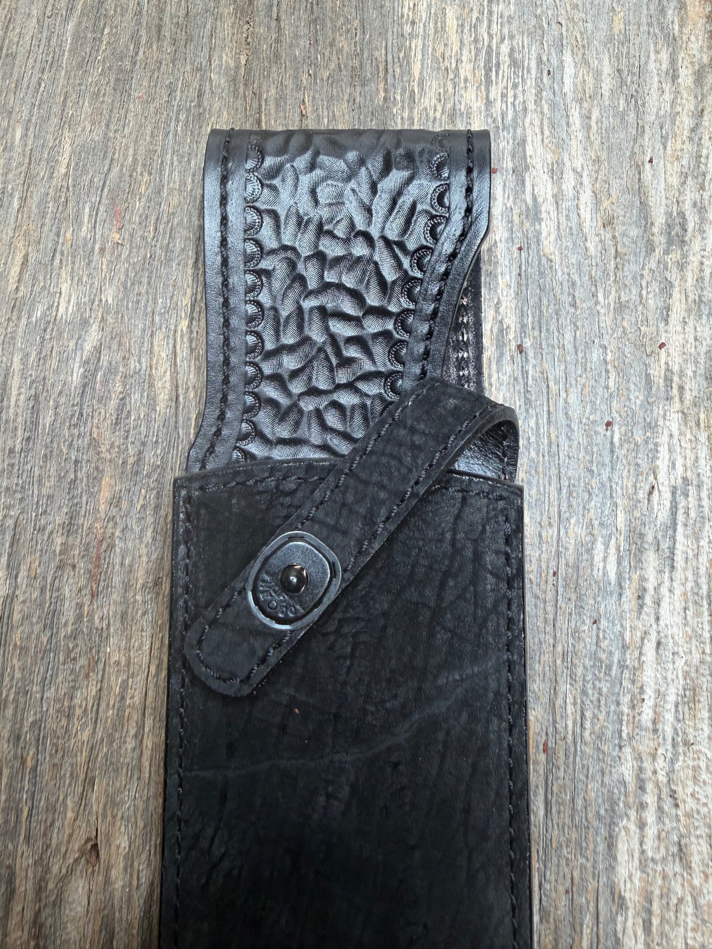 Randall Model 12-11 Large Sasquatch in Black Hippo, forward curved hilt, black Canteen Snap, full brass stamping and stitching.