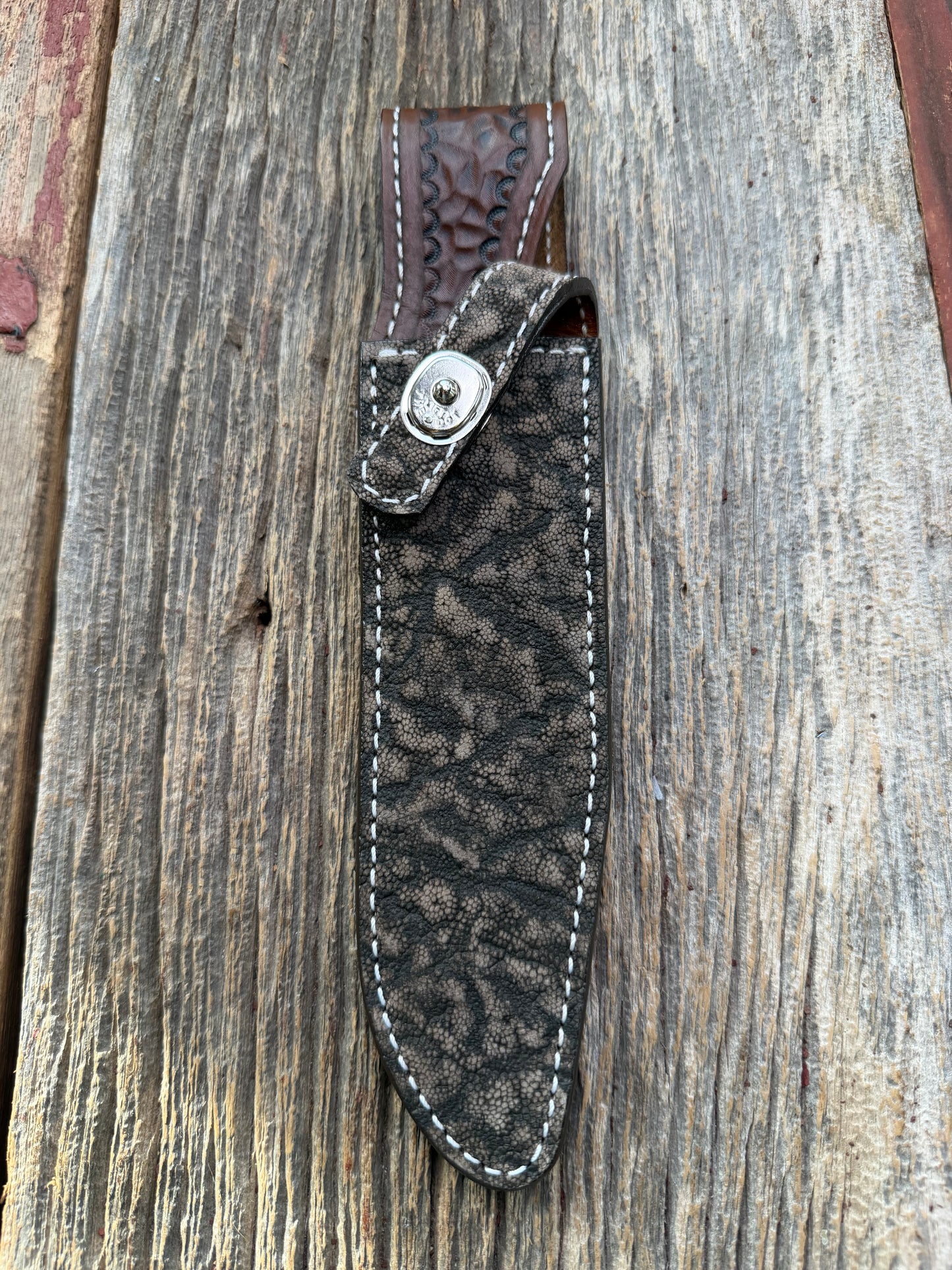 New Randall Model 1-7 Sheath in Exotic thick and textured Black and Grey Elephant Ear  on brown leather from Treeman with a silver Canteen snap. Hand tooled belt loop. Killer sheath.