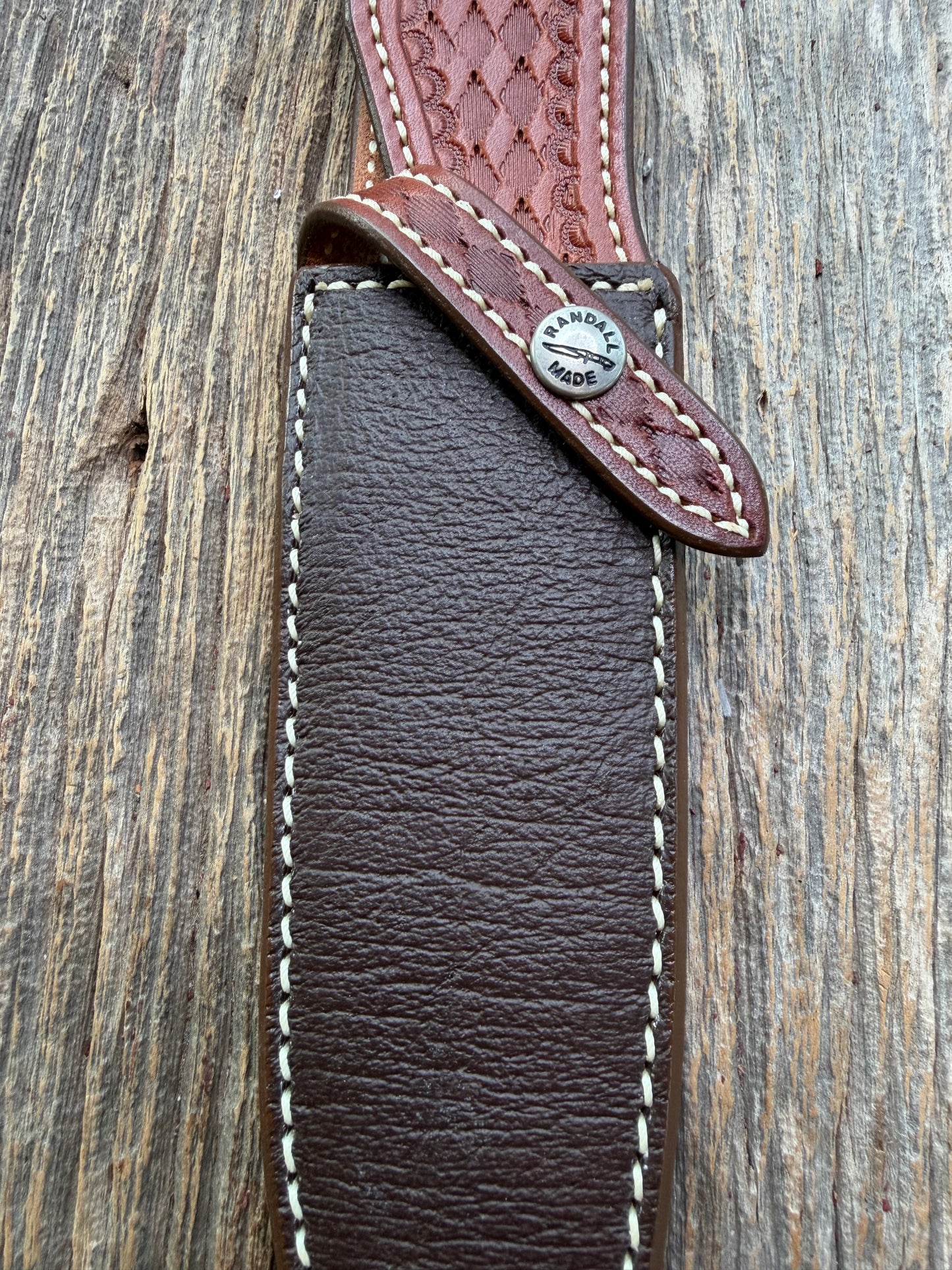 Pristine Randall Model 25-6 sheath in Exotic Cape Buffalo leather from Sullivans by Gutcher. Heavily tooled belt loop and strap. Randall snap and clean stamping on the back … perfect!!