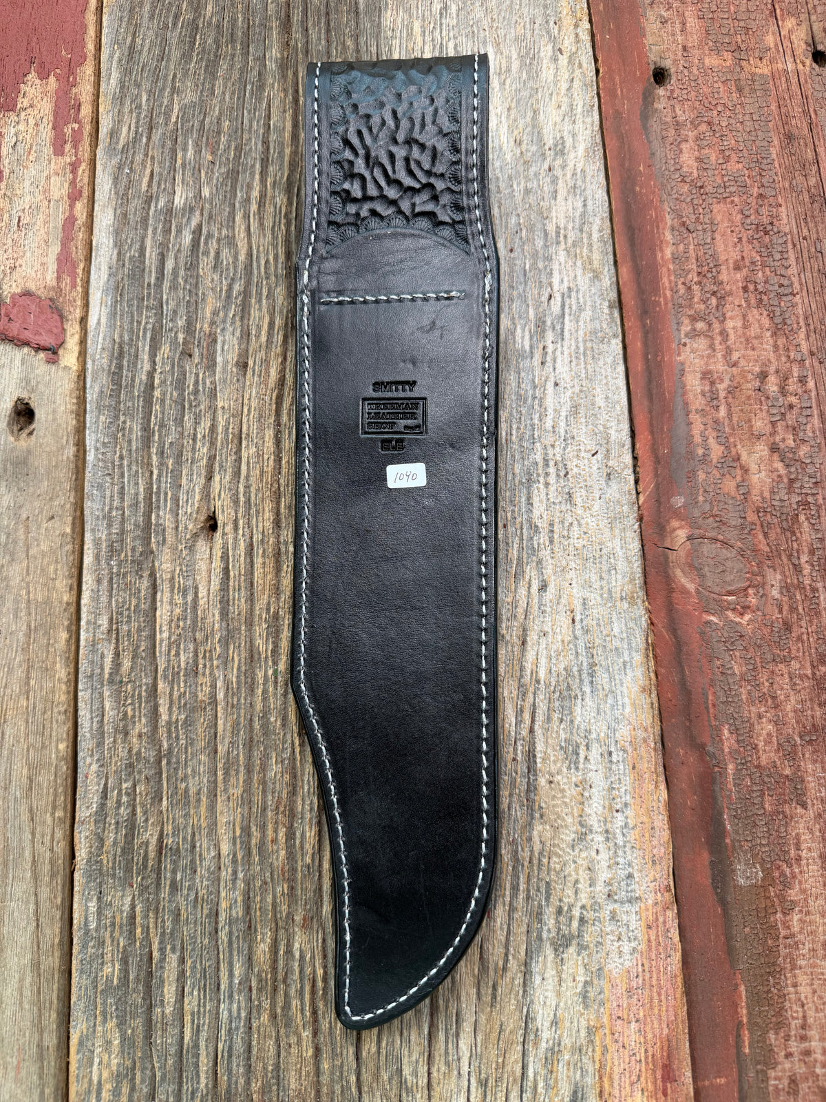 New Randall Model Smithsonian Sheath in Exotic Black Matte Elephant Hide from Treeman with a Black Canteen snap. White thread deviated stitching on black leather..Killer sheath.