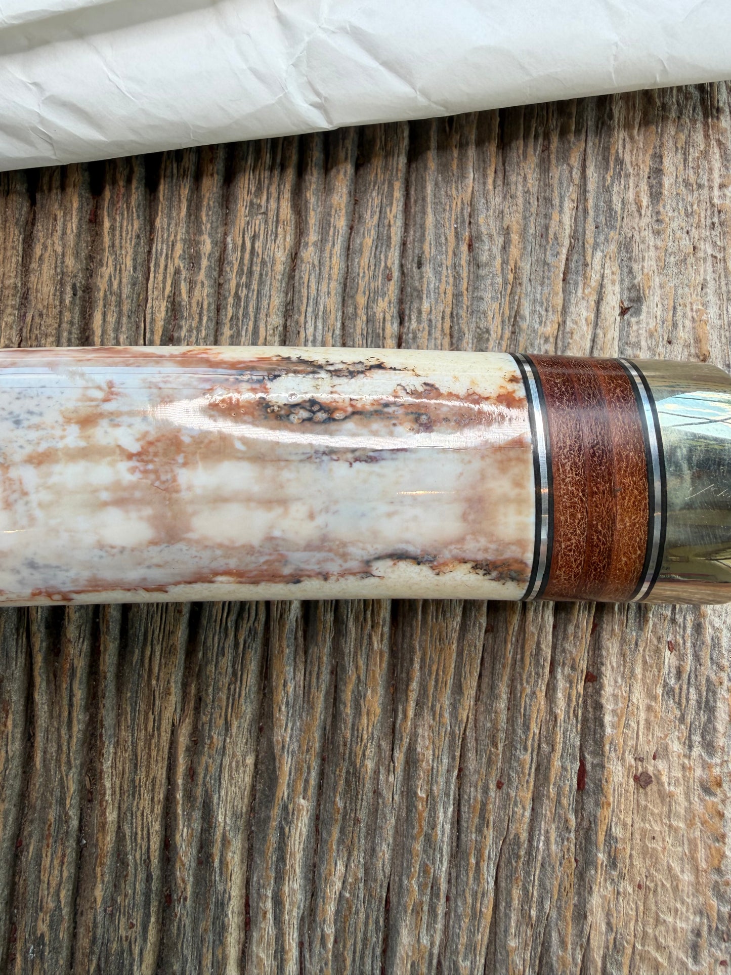 New in Paper Randall Model 12-9 Fossil Walrus Ivory and 25 style stacked Leather grip. Double Nickel Silver hilt and nickel butt cap.