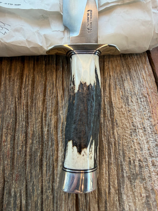 New in Paper Randall Non Catalog Model Sergeants Special. Nice Stag handle, Stainless blade, Nickel silver hilt and durillium butt cap. Brown leather sheath.