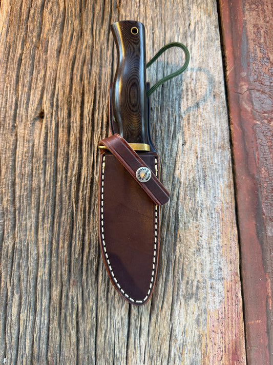 Nice Randall Model 28 Woodsman in Black Micarta. SS blade, brass single hilt. Lanyard. Brown leather sheath.