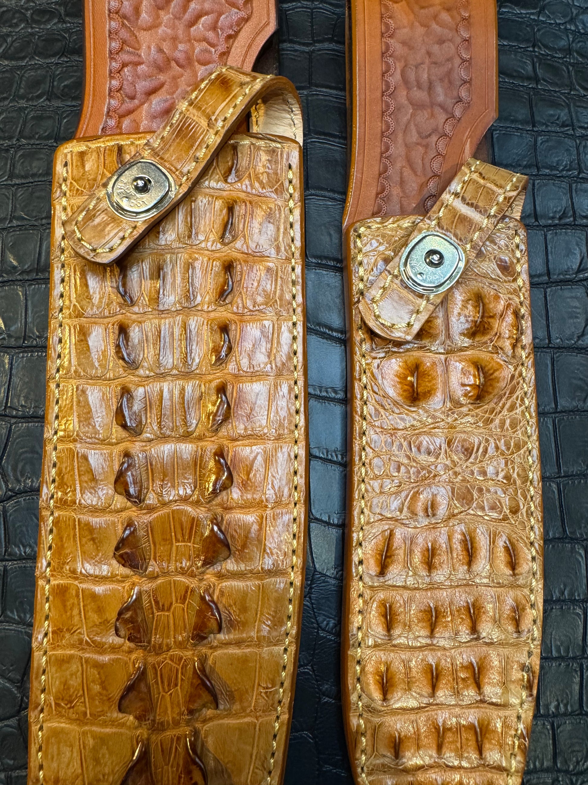A pair of Randall Model 12-11 Large Sasquatch (Tail) and Randall Model 12-8 Small Sasquatch (Skull) Sheaths in Exotic Tan Hornback Crocodile by Treeman.