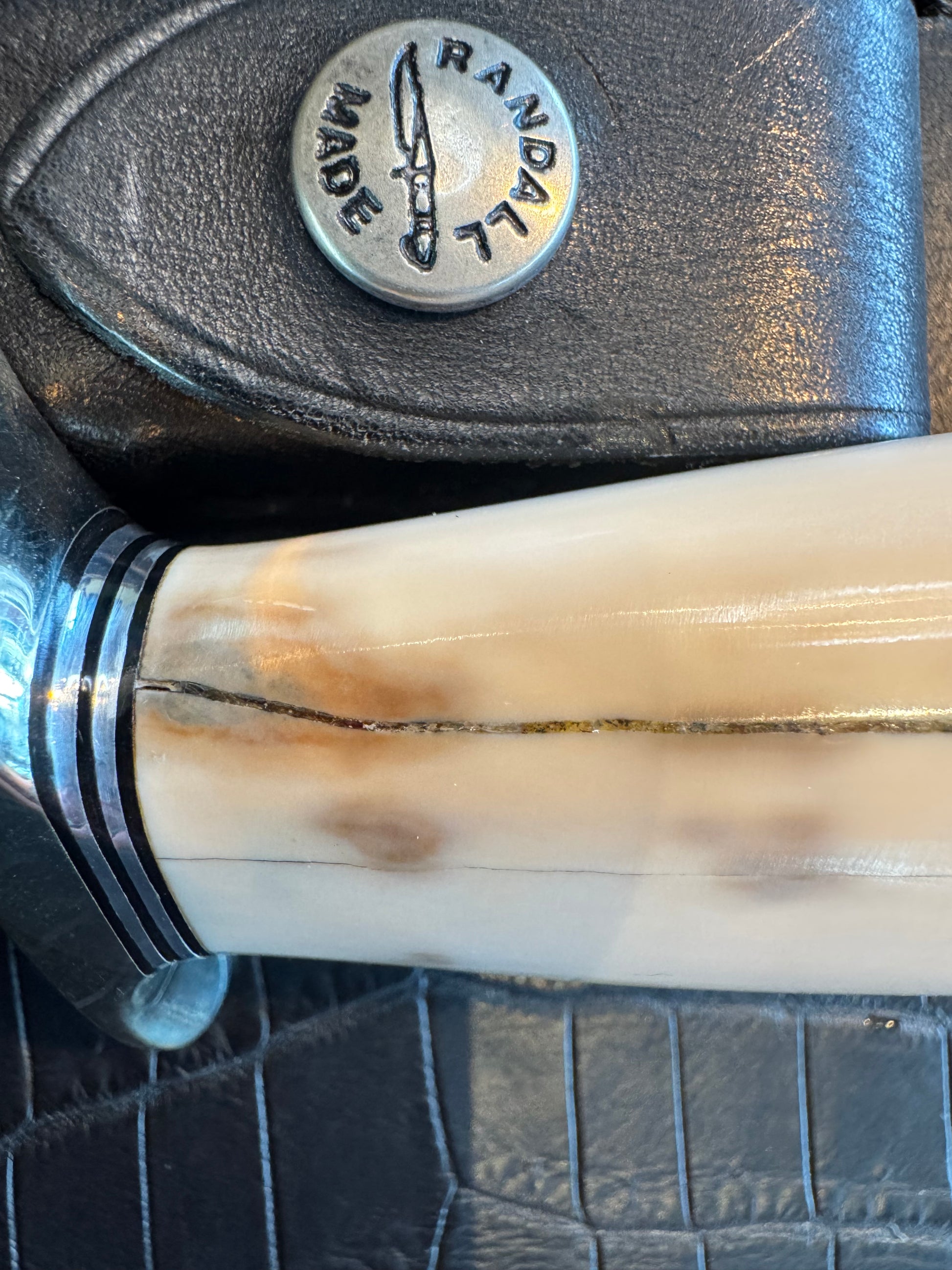 Randall Model 1-7 in Creamy Fossil Walrus Ivory. Nickel Silver Hilt and Aluminum Flanged Butt cap. ( slight crack)
