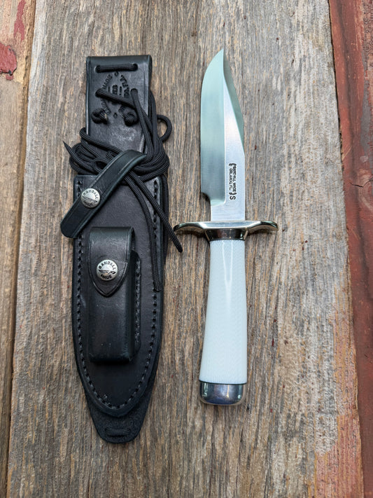 Randall Model 15 with a White Ivorite handle. Stainless steel blade, Nickel silver hilt and collar. Upgraded Black leather sheath.  Roundsd Aluminum butt cap.