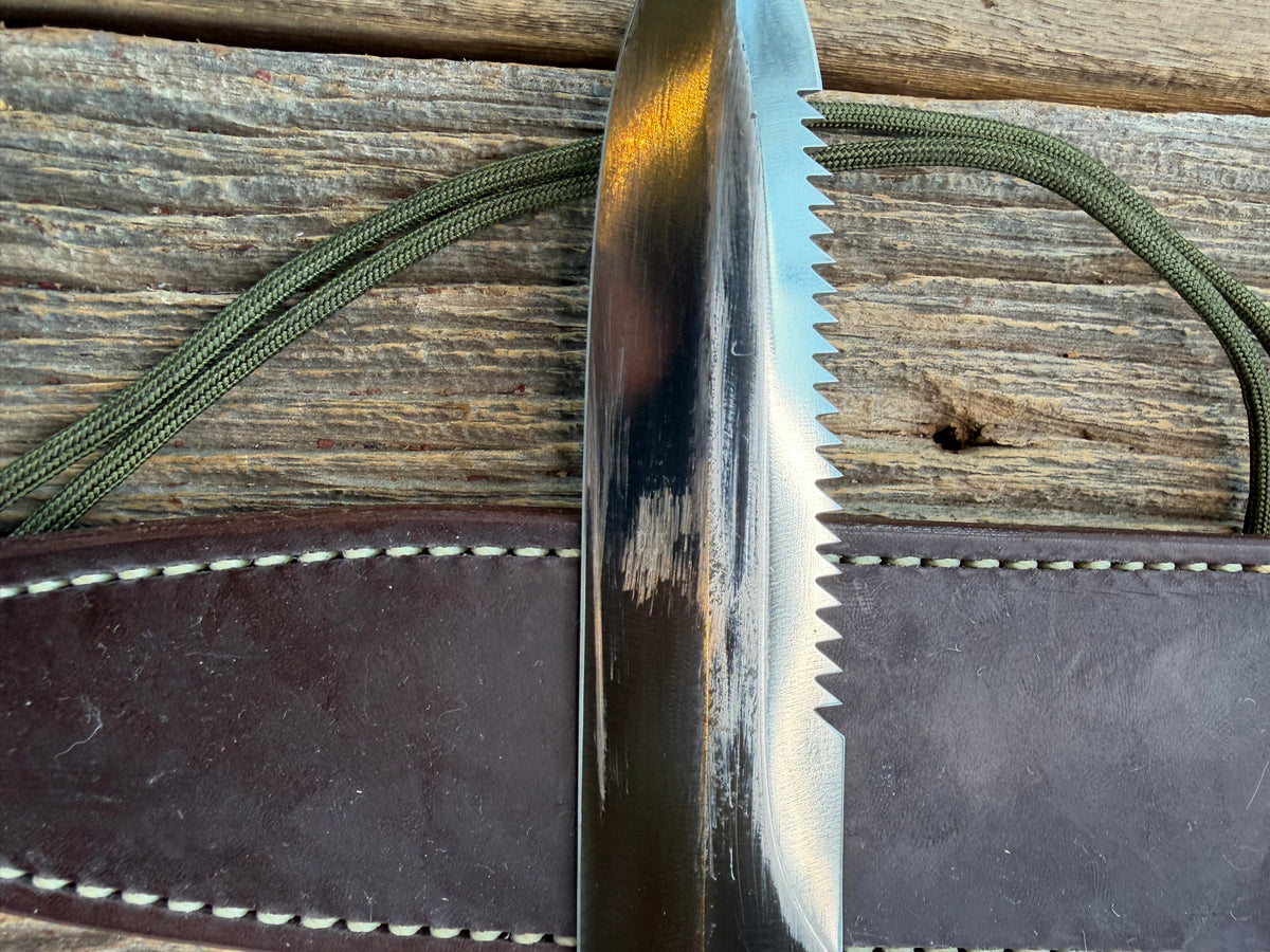 Nice Randall Model 16-7 with a glossy Brown Micarta handle. SS blade, double nickel silver hilt. Lanyard. Sawteeth, Brown waxed leather sheath.