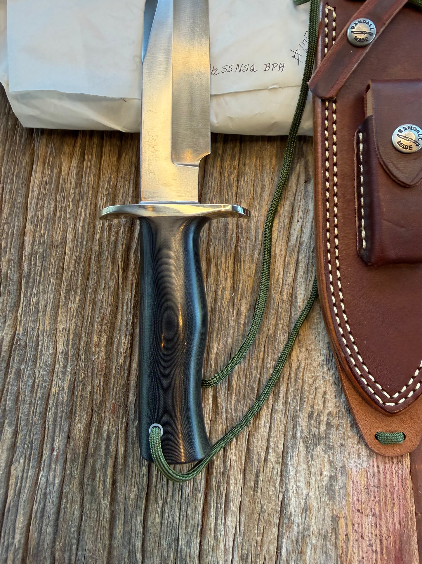 New in Paper Randall Model 14-7.5 in Black Micarta handle, Nickel Silver Hilt, Stainless steel, and Lanyard.
