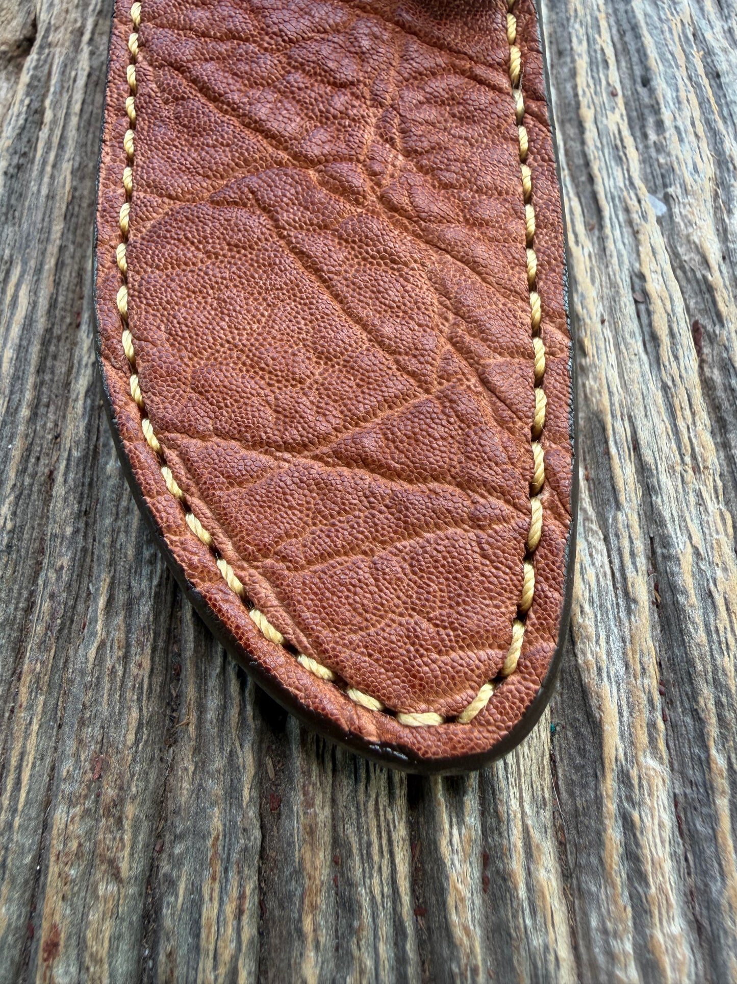 New Randall Model 23 Sheath in Exotic thick and textured Rust colored Elephant hide on brown leather from Treeman with a silver Canteen snap. Hand tooled belt loop. Killer sheath.