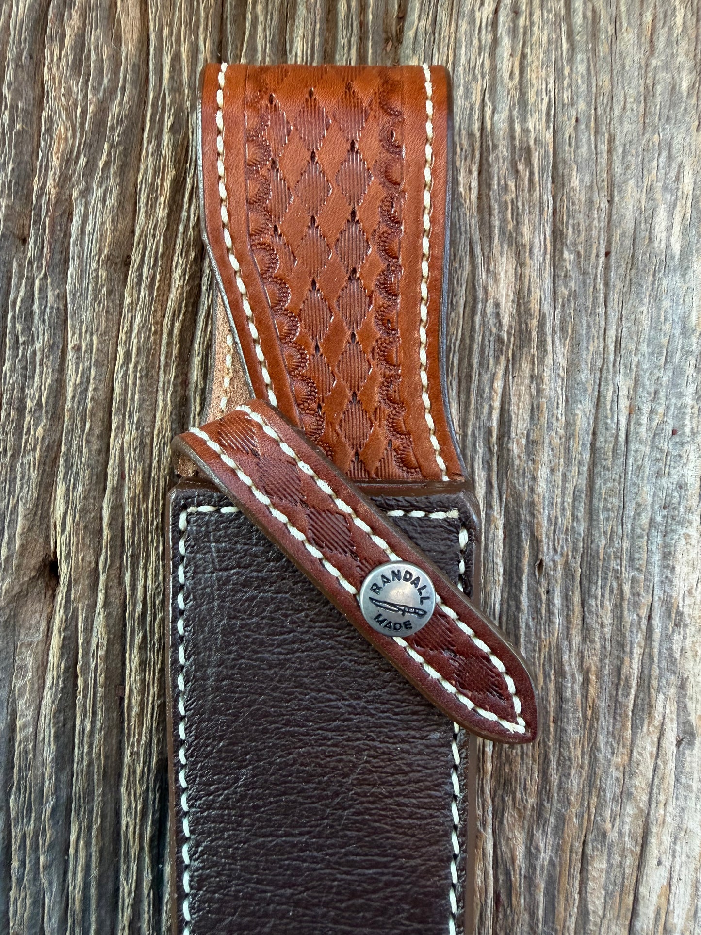 New Randall Model 25-6 Sheath in Exotic Brown Cape Buffalo with full leather hand tooled belt loop. Randall snap and stamp on the back. Custom Made at Sullivan’s by Gutcher