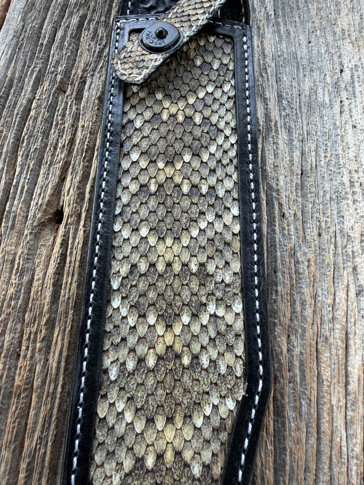 Randall Model Confederate sheath with inlayed Western Diamondback RattleSnake skin from Treeman Sheaths. Very dark skin on brown leather, white deviated stitching and black canteen snaps.