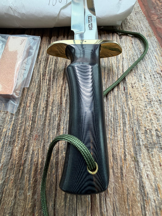 New in Paper Randall Model 16-7 Diver with a Black Micarta handle, Single finger grip , SS blade, Brass hilt, Sawteeth, Lanyard, Brown leather waxed sheath.