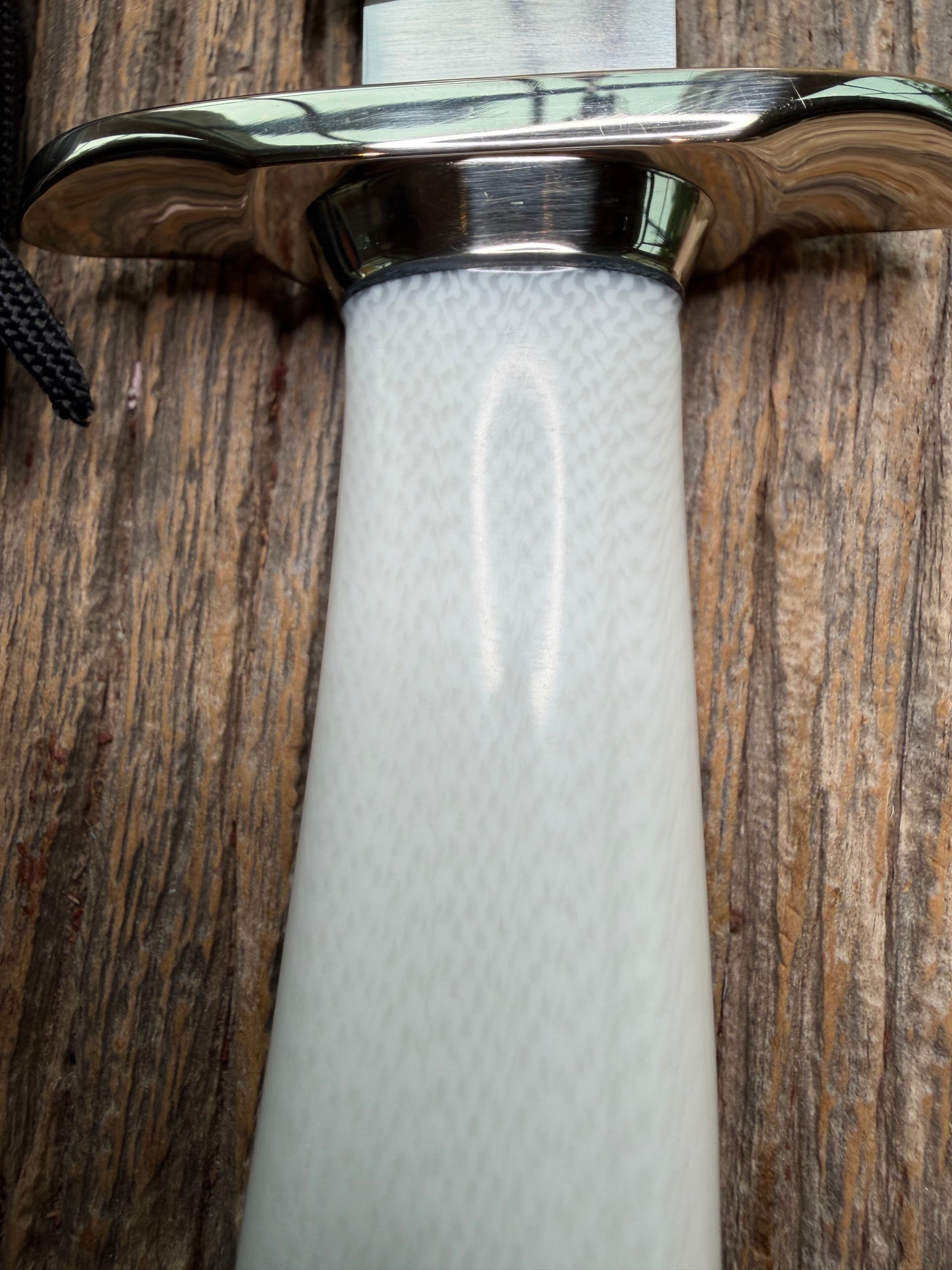 Randall Model 15 with a White Ivorite handle. Stainless steel blade, Nickel silver hilt and collar. Upgraded Black leather sheath.  Roundsd Aluminum butt cap.