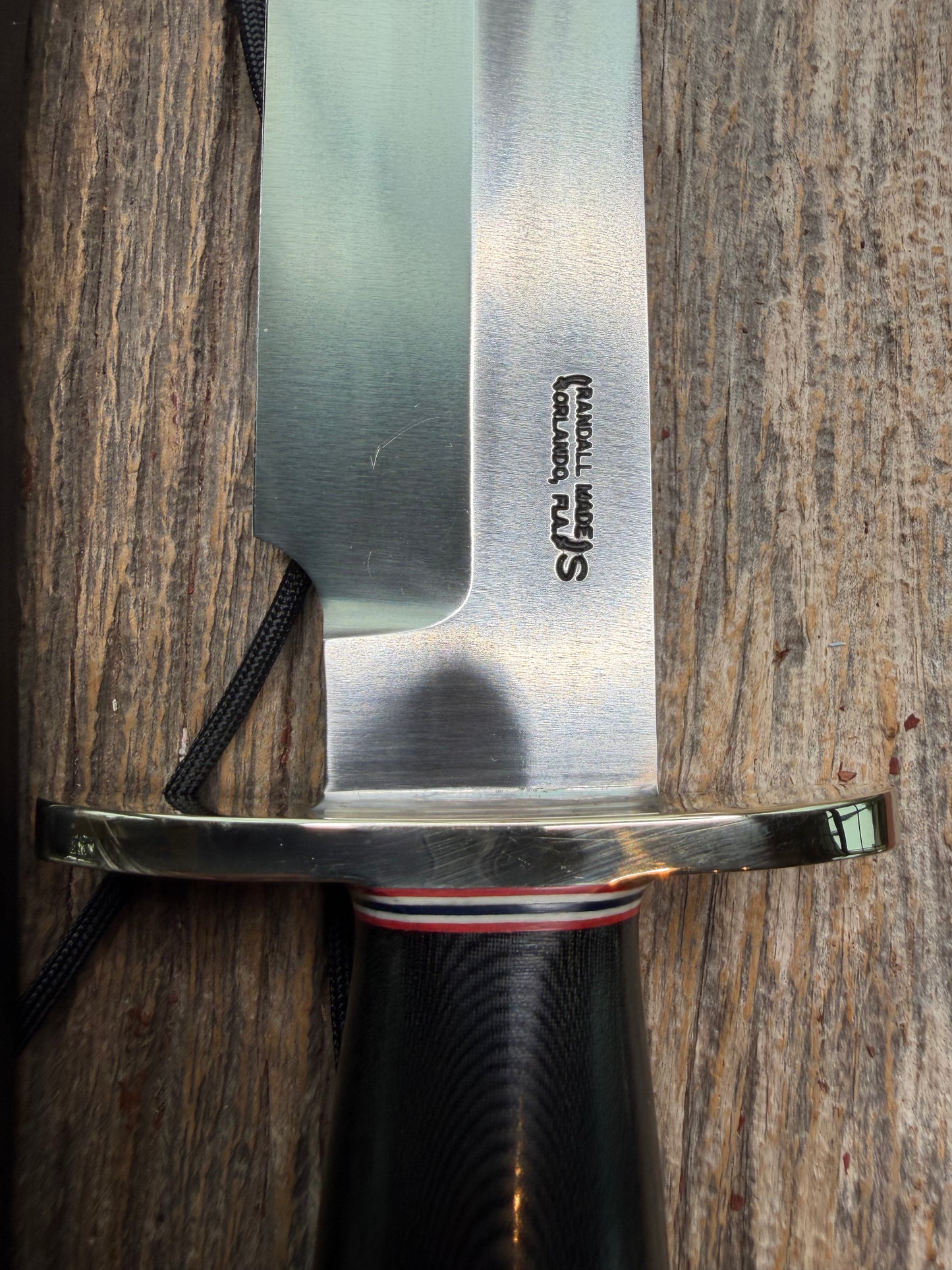 Nice Randall Model 12-9 in black Micarta handle. Red white and Blue spacers, Double Nickel Silver hilt, aluminum butt cap. Stainless blade.