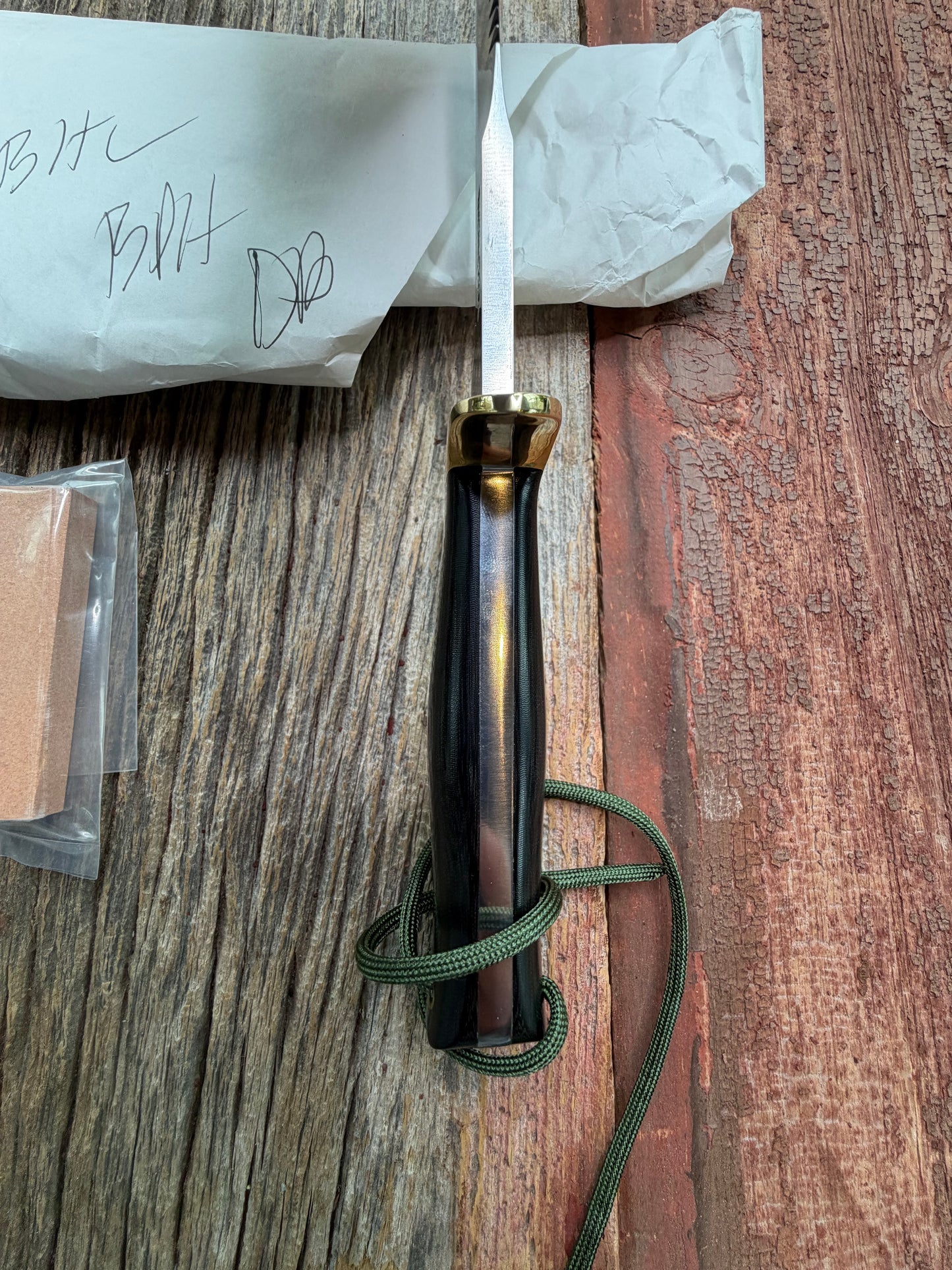 New in Paper Randall Model 16-7 Diver with a Black Micarta handle. SS blade, Brass hilt, Sawteeth, Lanyard, Brown leather waxed sheath.