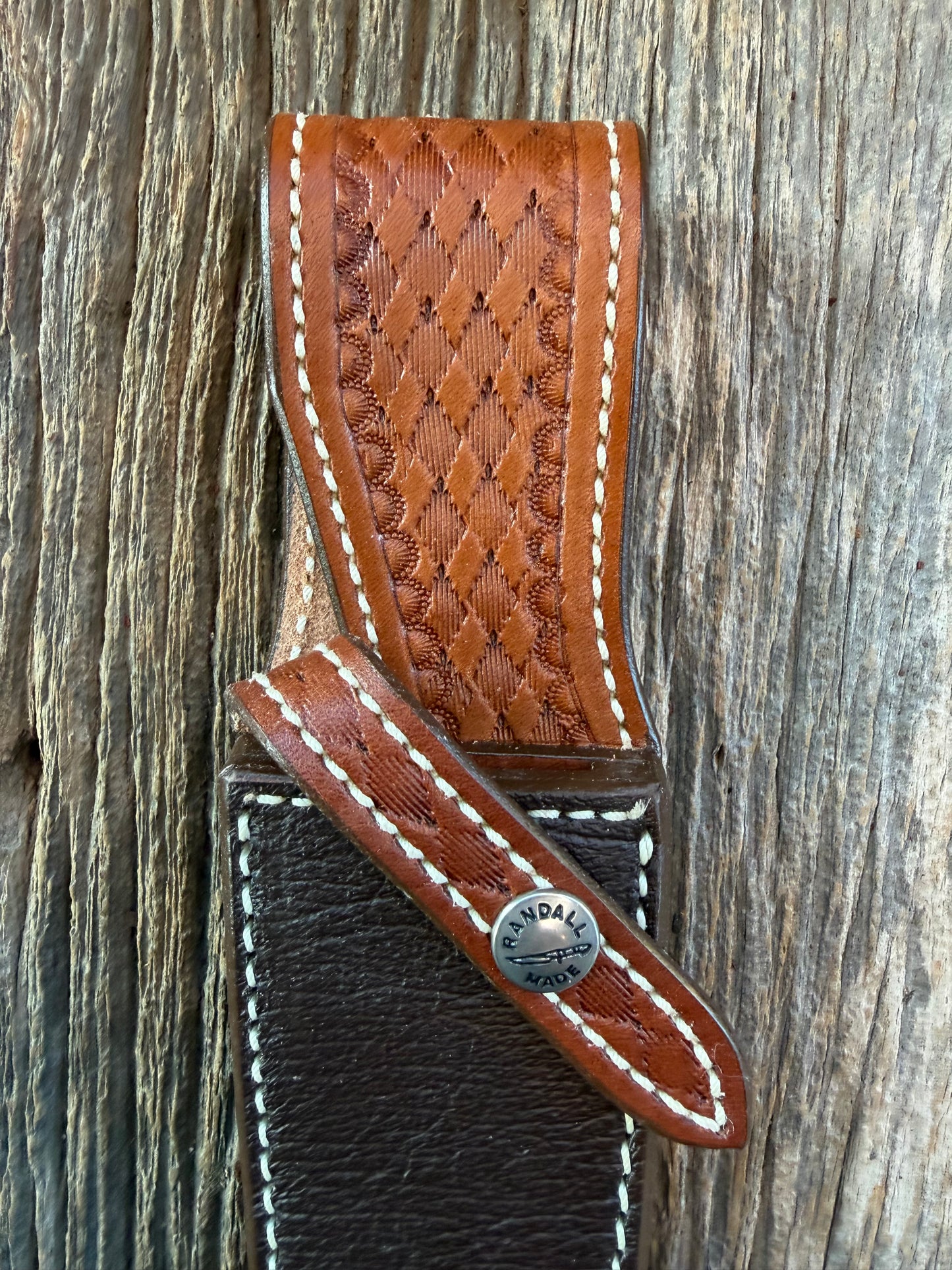 New Randall Model 25-5 Sheath in Exotic Brown Cape Buffalo with full leather hand tooled belt loop. Randall snap and stamp on the back. Custom Made at Sullivan’s by Gutcher