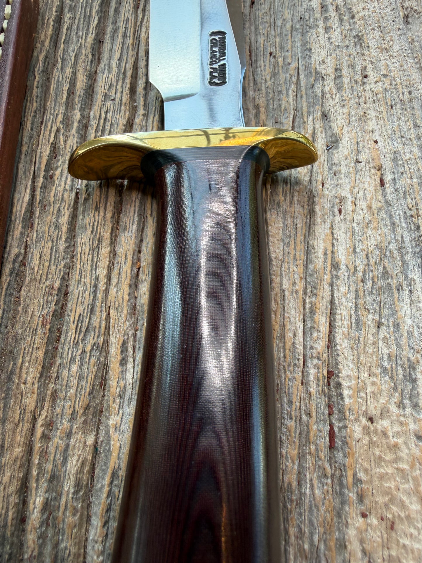 New in Paper Randall Model 1-7 Maroon Micarta Brass Hilt, Natural end, single black spacer, carbon steel.