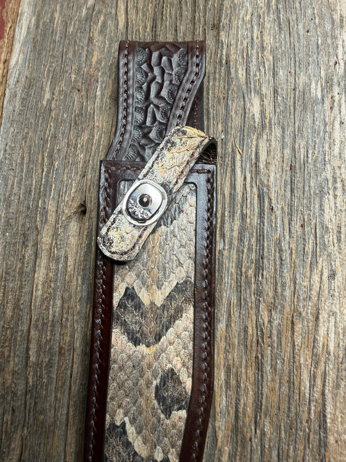 Randall Model 1-7 sheath with a Canebrake RattleSnake skin from Treeman Sheaths. Vibrant colors and along side Copperheads the hardest skin to source.